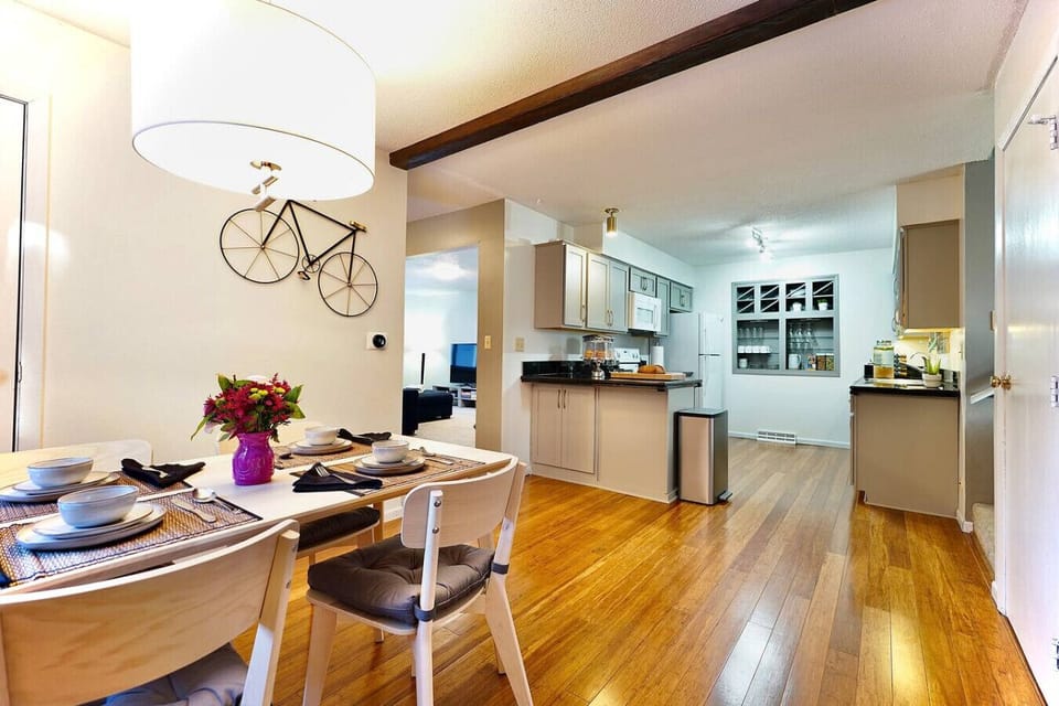 Bright dining and kitchen space with open layout and comfortable seating.