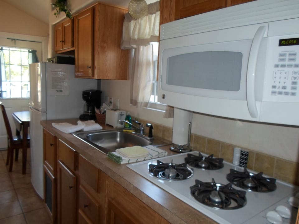 Fridge, microwave, stovetop, coffee/tea maker