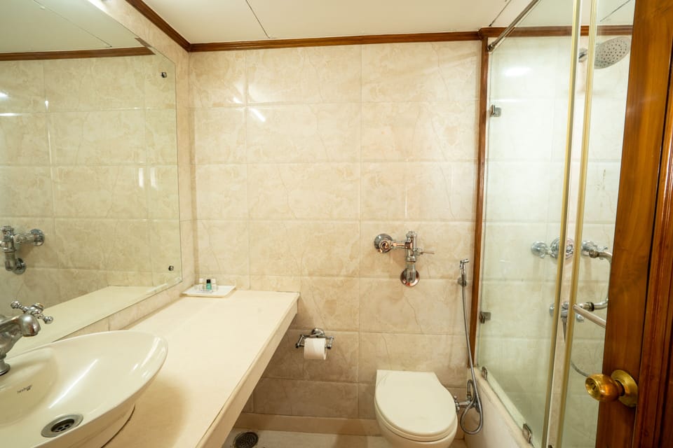 Shower, rainfall showerhead, slippers, towels