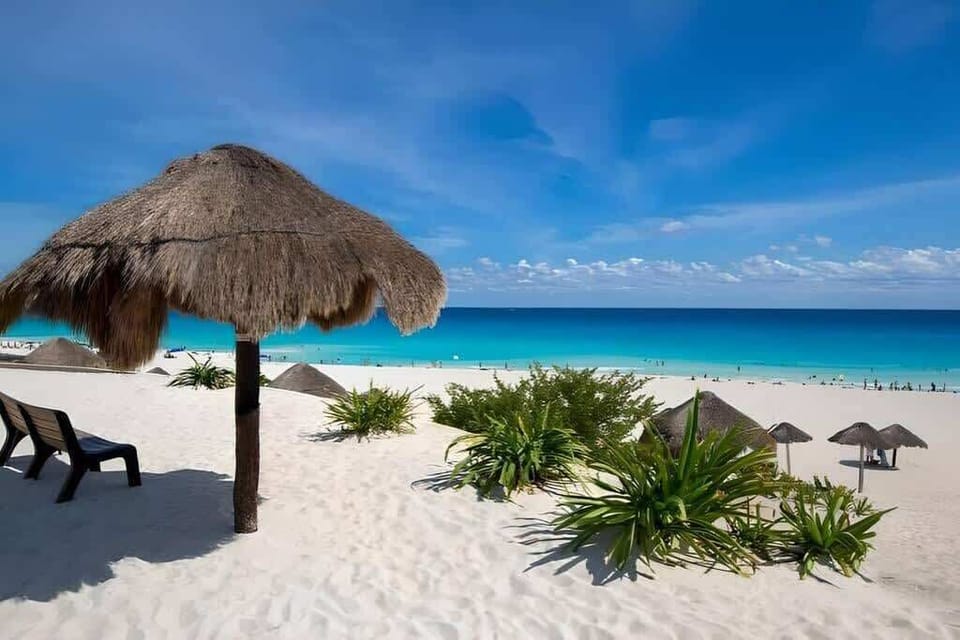 Nearby: Caribbean beach with palapa shade