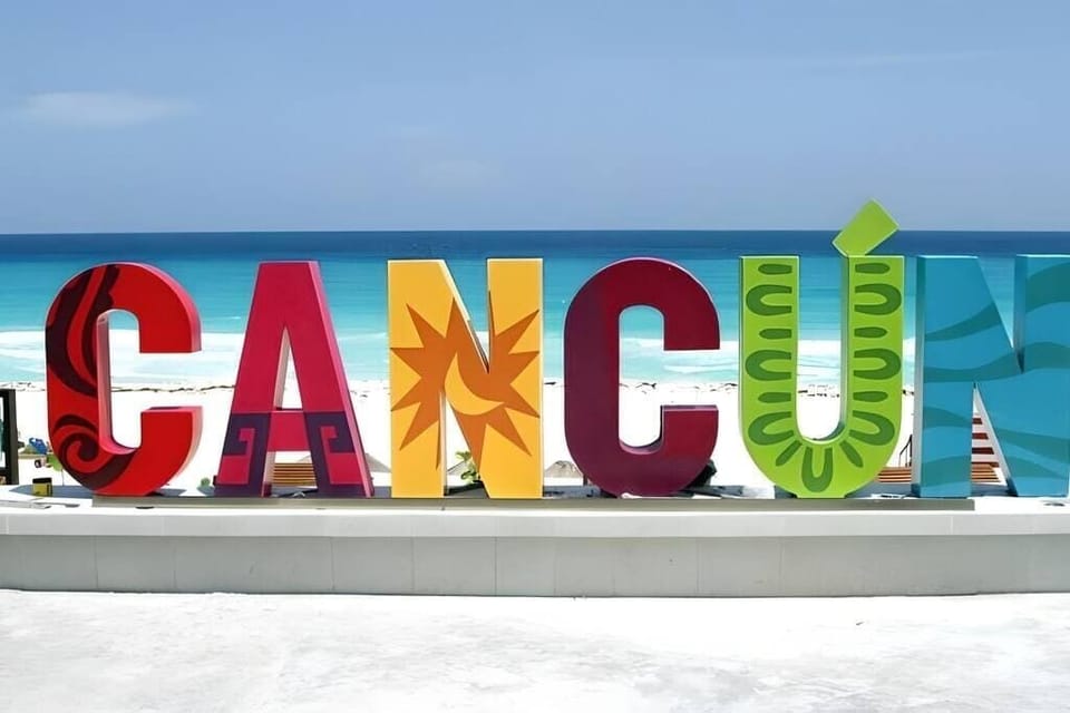 Nearby: iconic Cancun sign