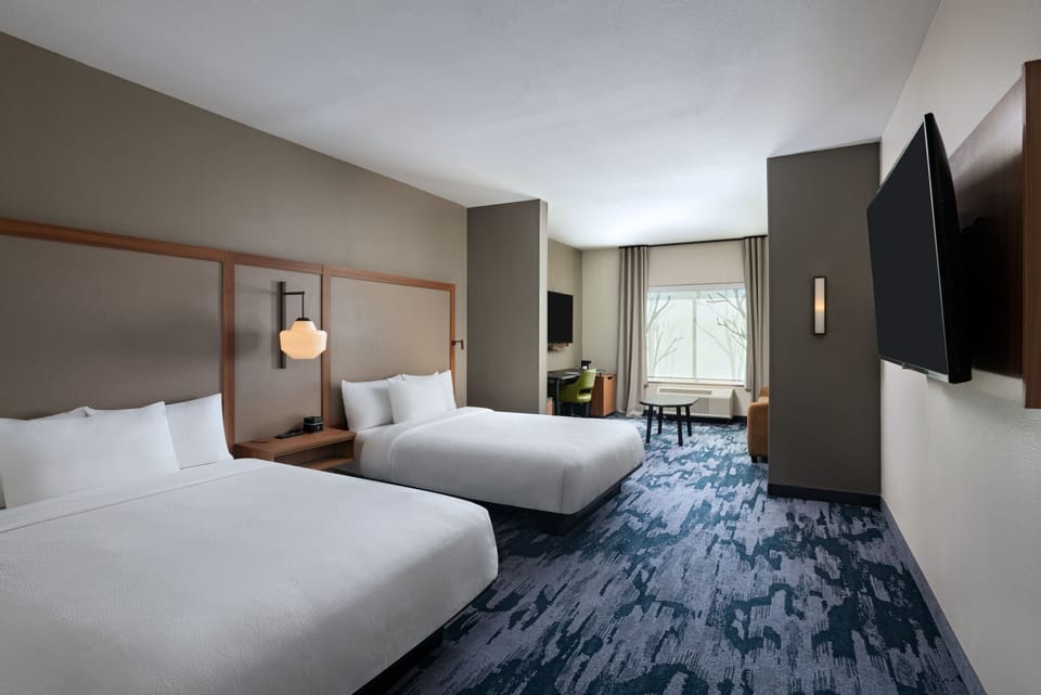 Suite, Multiple Beds | Desk, laptop workspace, blackout drapes, iron/ironing board
