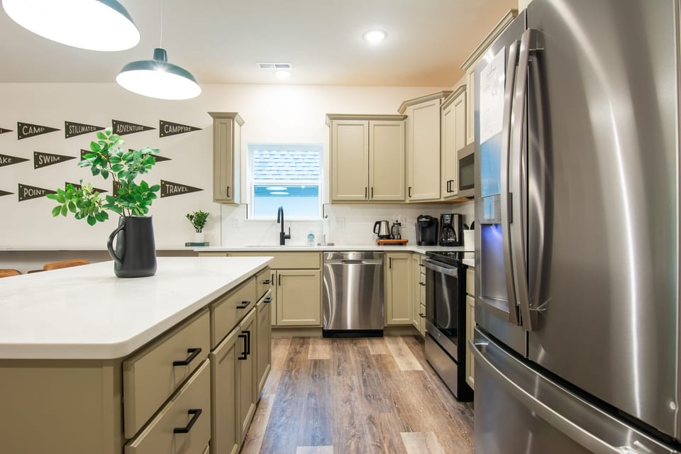 Kitchen with island to prepare on or use as more seating