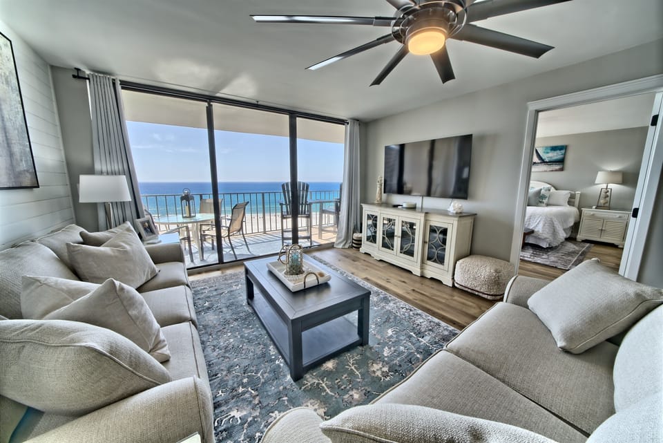 Living room is spacious with an amazing view of the Gulf of Mexico and the lagoon pool