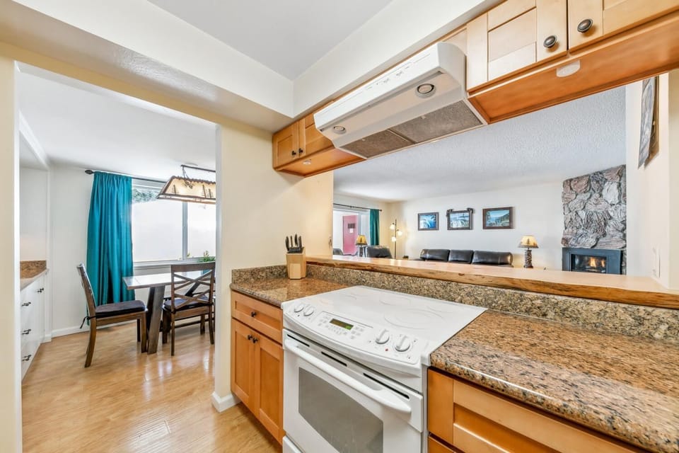 Kitchen features oven, 5-burner electric stove, dishwasher, microwave, fridge, and more