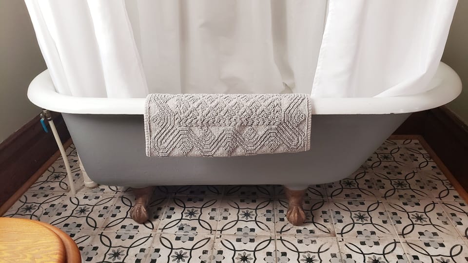 2nd floor en suite bathroom with clawfoot tub and shower combination