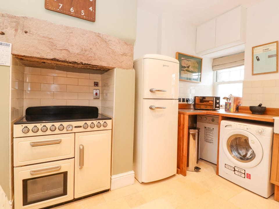 Fridge, electric kettle, toaster, cookware/dishes/utensils