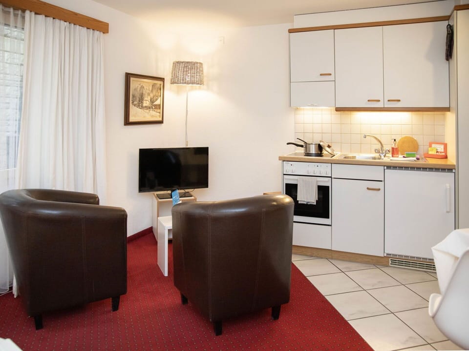 Furniture, Interior Design, Flooring, Floor, Room, Table, Picture Frame, Television, Ceiling, Lighting