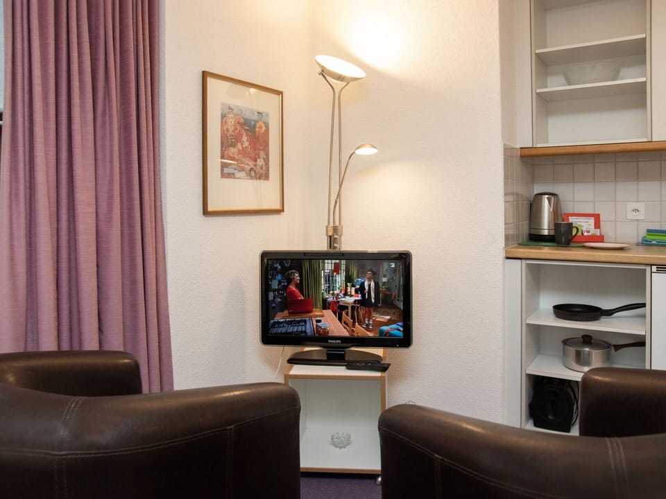 Furniture, Interior Design, Electronic Device, Television, Television Set, Room, Flooring, Floor, Lighting