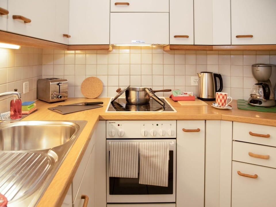 Kitchen, Kitchen Appliance, Countertop, Major Appliance, Cabinetry, Wood, Kitchen Sink, Plumbing Fixture, Stove, Interior Design
