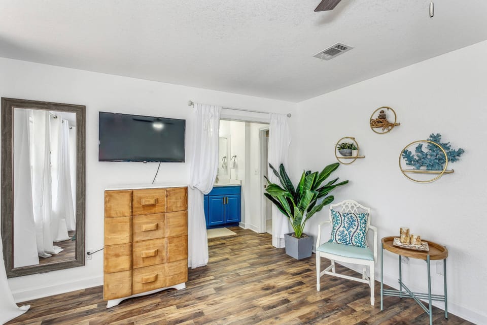 Primary bedroom with new flooring and en suite bathroom
