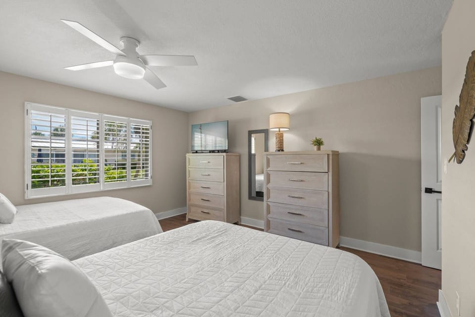 Two dressers and a closet provides plenty of storage