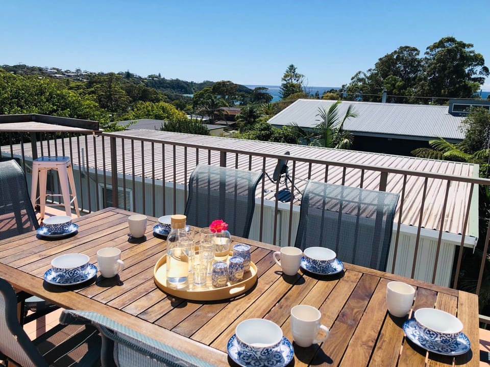 Outdoor dining on the upper deck with a glorious 180 degree ocean view.