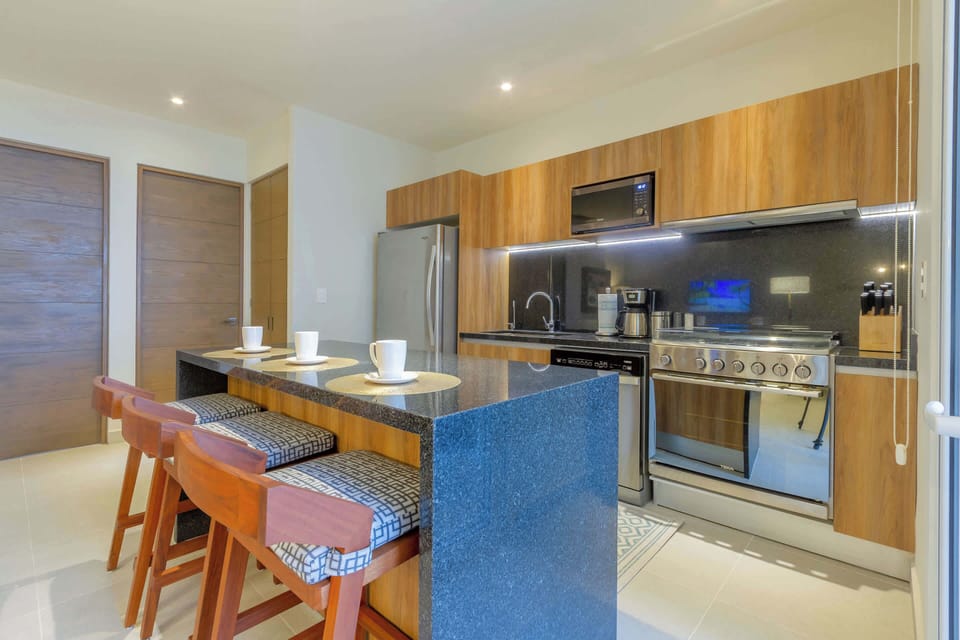 A fully equipped kitchen for preparing meals at home.