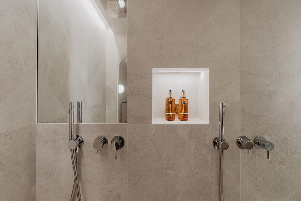Shower, hair dryer, slippers, towels