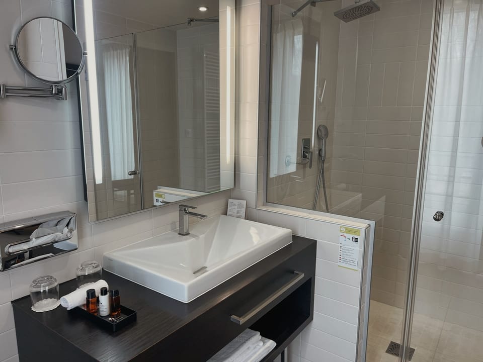 Separate tub and shower, bathrobes, slippers, towels