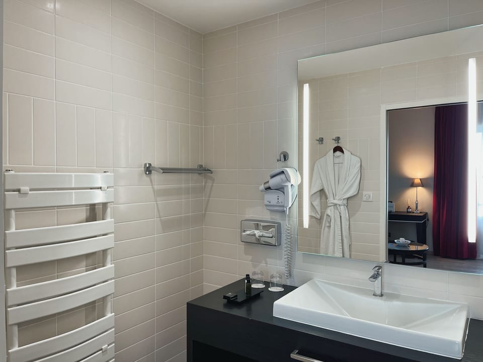 Separate tub and shower, bathrobes, slippers, towels