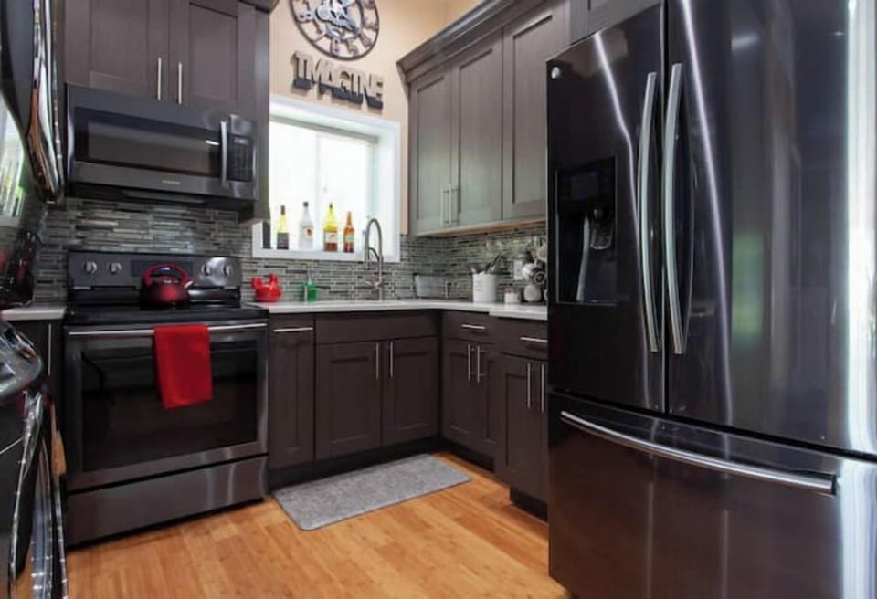 The kitchen is brand-new and fully-equipped with high-end stainless steel 