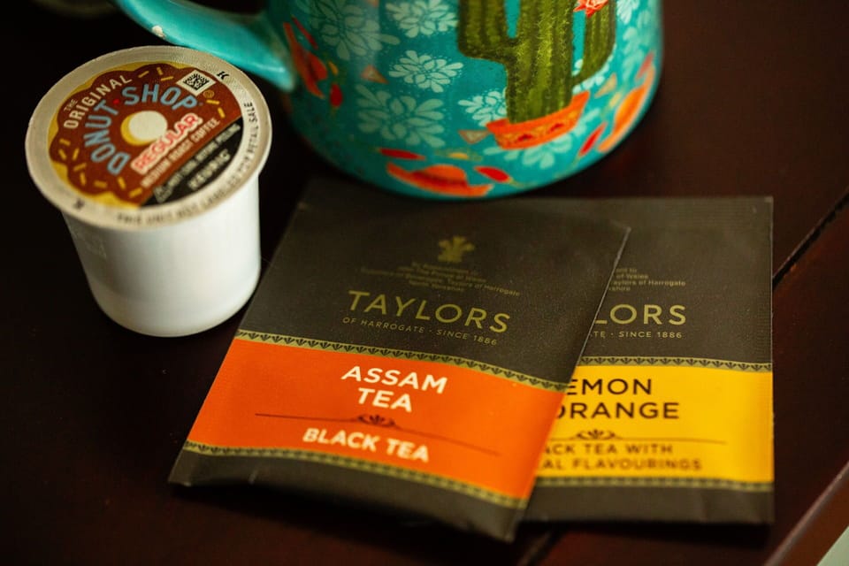 The coffee bar has both tea and coffee.