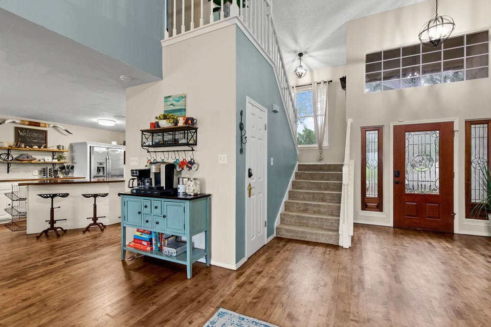 This is the entrance with a view of the stairs and coffee bar.
