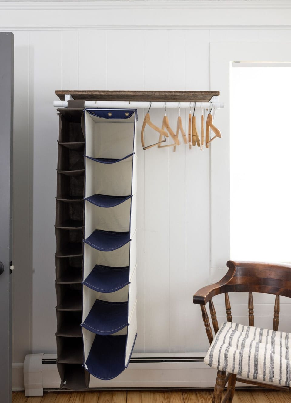 Twin Bedroom  Features two twin beds with organic cotton bedding, air conditioning, a wool rug, and hanging space. The wall displays Beckerman Photography’s “Two Hens” from the Sustainable Celebrities series. 🐔🎨📷