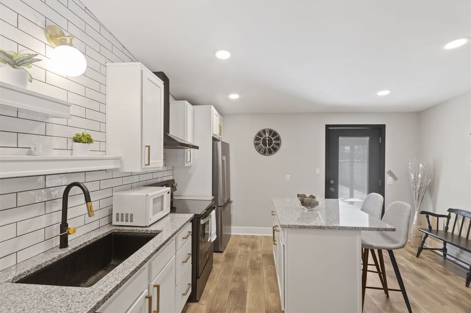 Kitchen cabinetry stocked with cooking & dining essentials