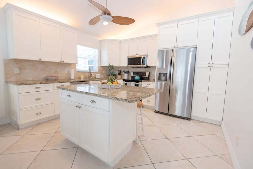 Prepare your favorite meals in this open concept kitchen with all stainless steel appliances.