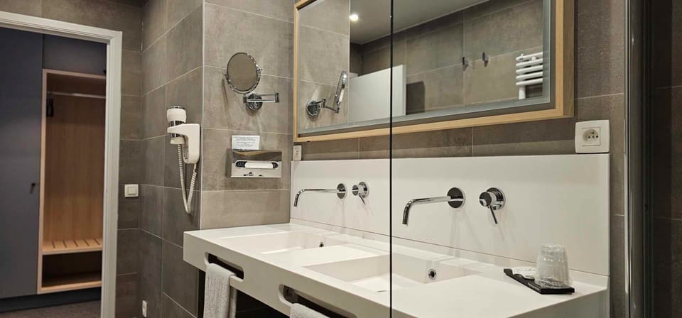 Designer toiletries, hair dryer, towels, soap