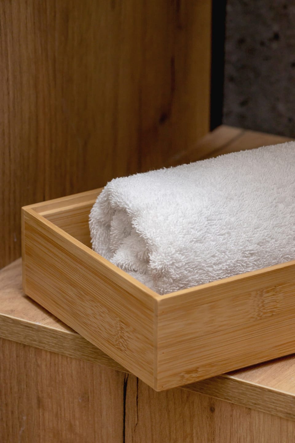 A drawer with neatly folded towels, showcasing attention to detail.

