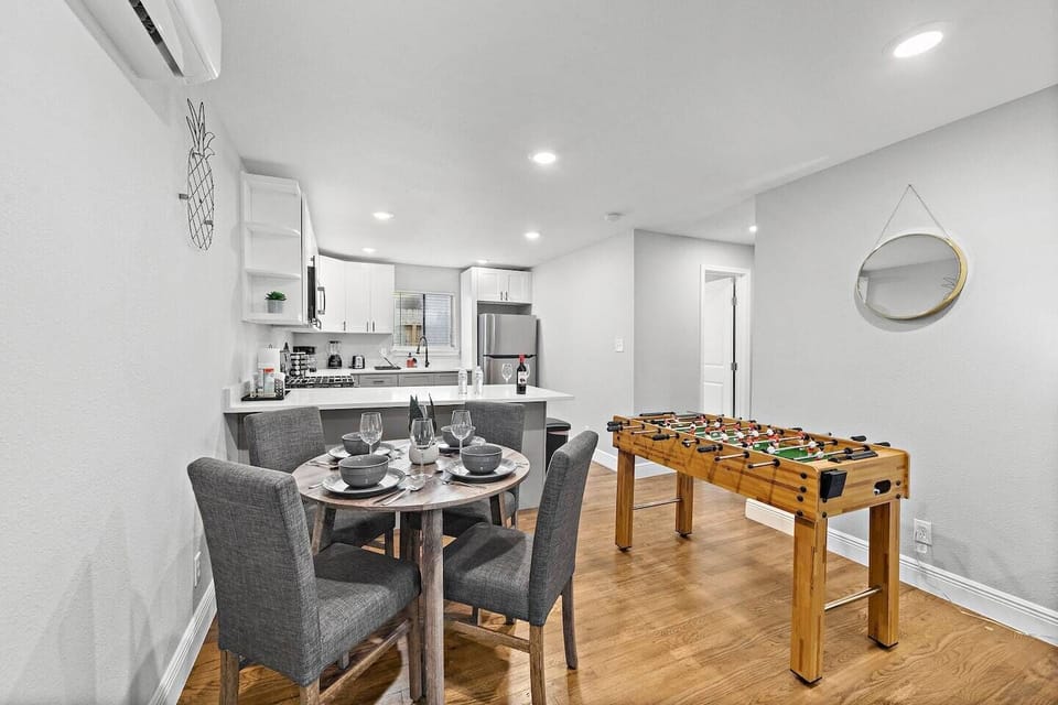 Spacious dining table with full tableware and silverware included.