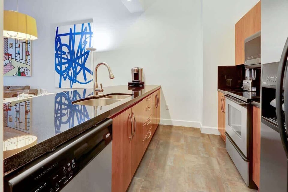 Fully equipped kitchen with complete set of cookware.