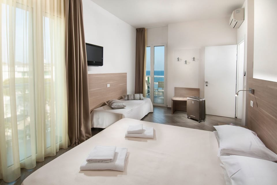 Standard Quadruple Room, Balcony, Sea View | In-room safe, desk, soundproofing, free WiFi