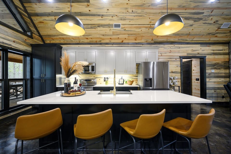 Fully equipped kitchen with high-end appliances, generous counter space, and all the tools needed to prepare group meals with ease.