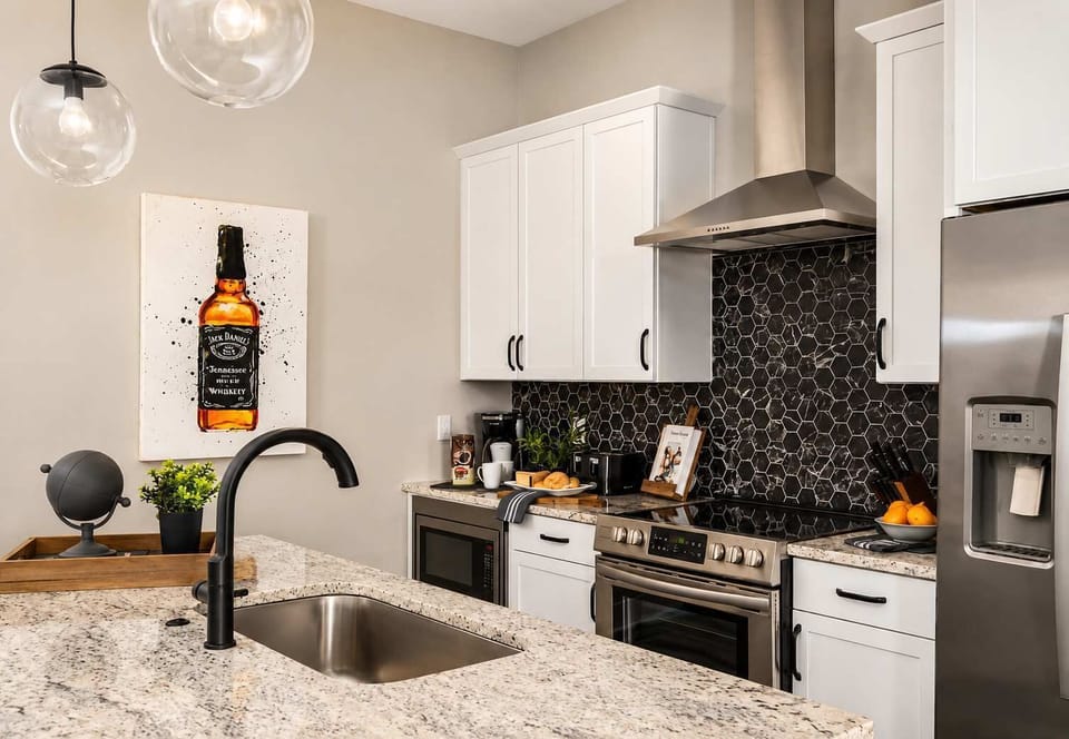 Fully stocked kitchen with island for prep and dining