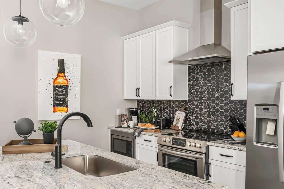 Fully stocked kitchen with island for prep and dining
