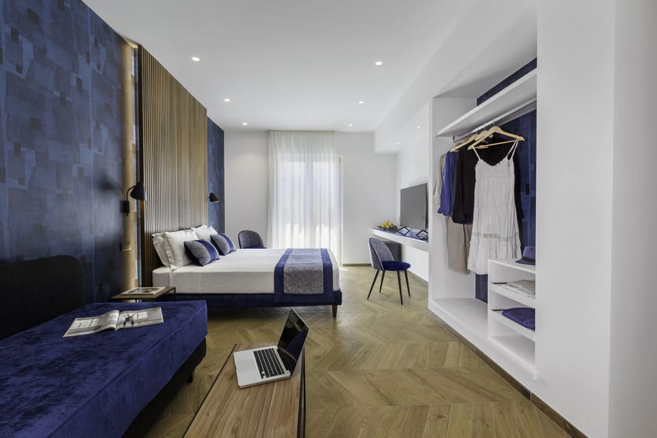 Superior Triple Room | Down comforters, minibar, in-room safe, individually decorated