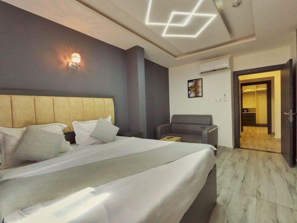 Quadruple Room | Minibar, in-room safe, blackout drapes, iron/ironing board