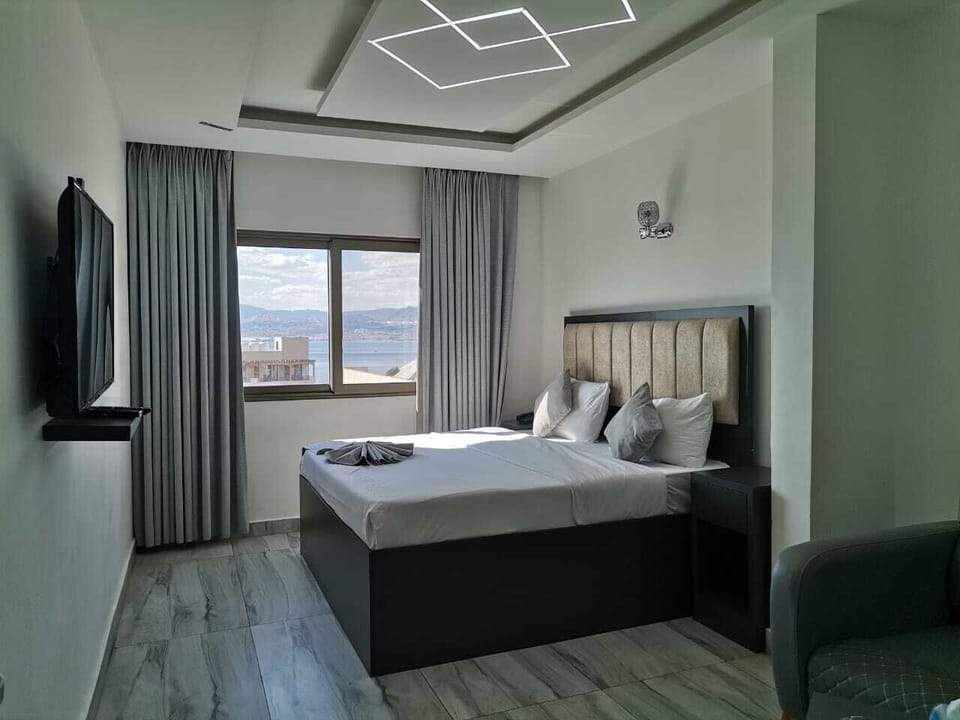 Quadruple Room | Minibar, in-room safe, blackout drapes, iron/ironing board