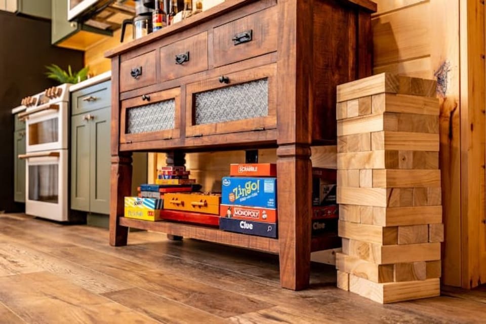 Coffee bar on top, games to enjoy with the family on the bottom.