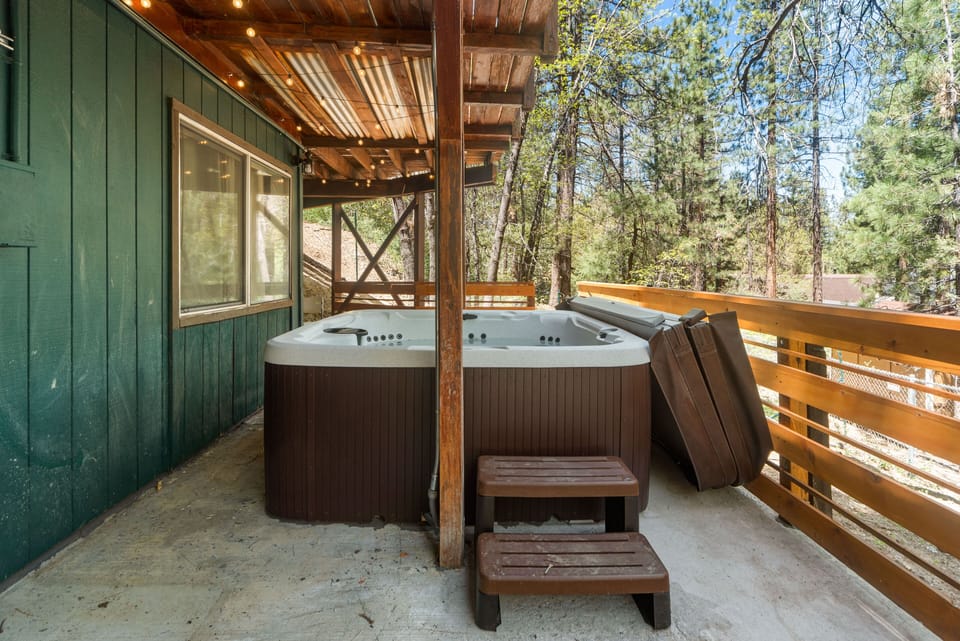 The outdoor hot tub on the bottom floor deck creates a refreshing ambiance 