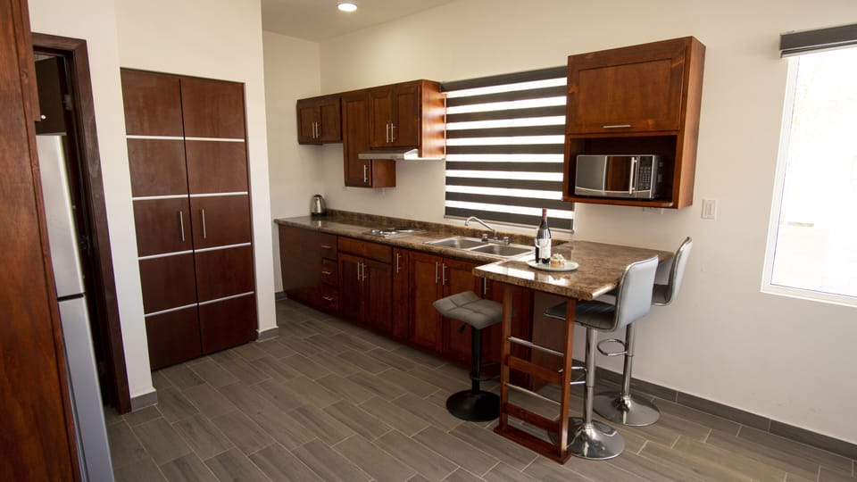 Comfort Condo | Private kitchen | Full-size fridge, microwave, stovetop, cookware/dishes/utensils