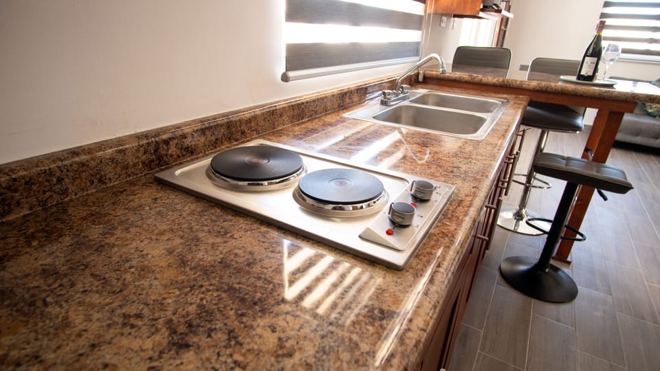 Comfort Condo | Private kitchen | Full-size fridge, microwave, stovetop, cookware/dishes/utensils