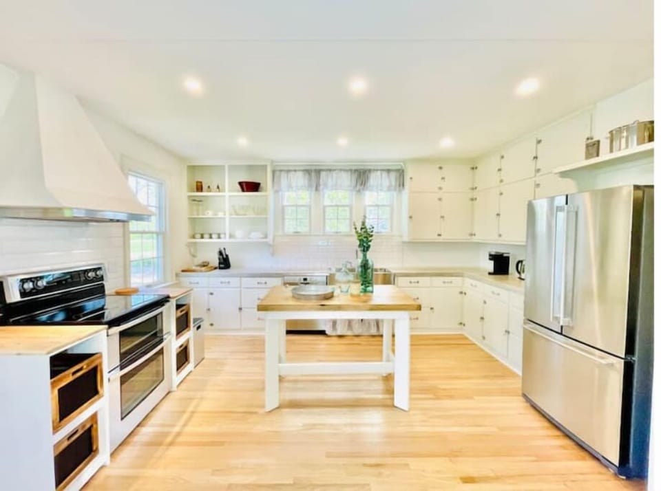 Charming spacious vintage kitchen with prep island and modern appliances.