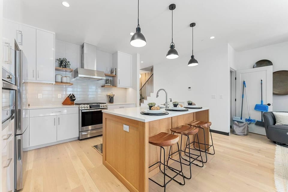 Beautiful Kitchen with island with comfy stools.