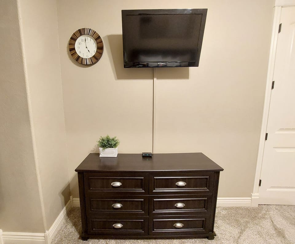 Spare Bedroom's Mounted TV and dresser directly across from the bed!