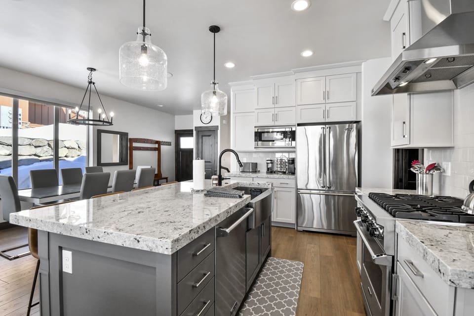 The thoughtfully designed open kitchen offers plenty of space for preparing meals while staying connected with family and friends.