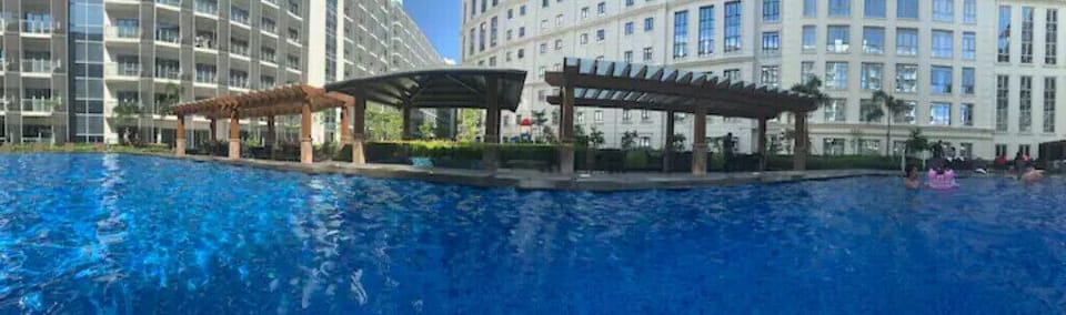 Pool is on the 2nd Floor.  Condo is in the building on the Right.