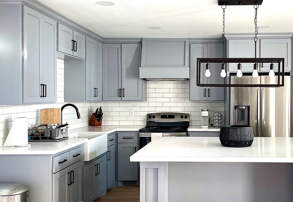 This brand new modern kitchen is perfect for all of your cooking needs with an electric stove, oven, and microwave.