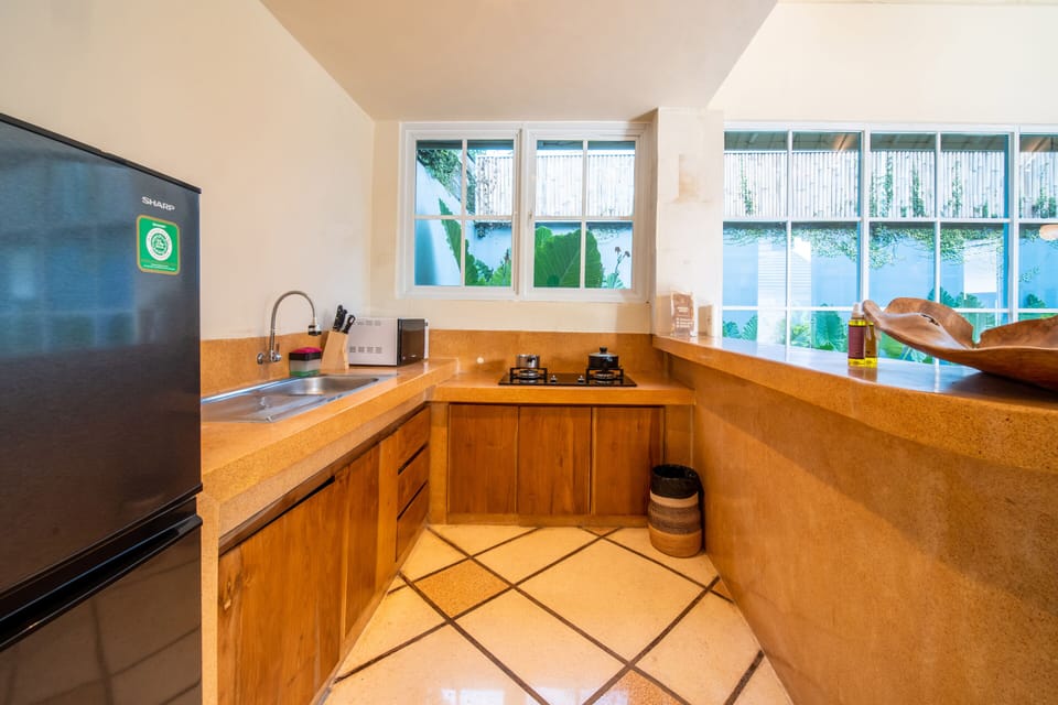 Deluxe Villa | Private kitchen | Fridge, stovetop, coffee/tea maker, electric kettle