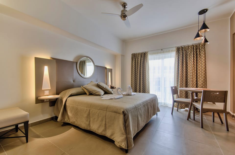 Memory foam beds, minibar, in-room safe, blackout drapes